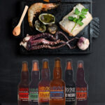 Parrilla lista para encender + Combo de Mariscos + 6 Pack Cherusker